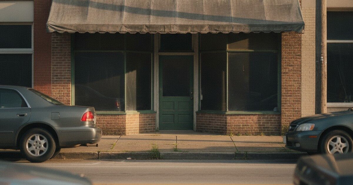 A small brick storefront lending office on a downtown block